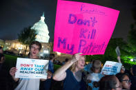 <p>Demonstrators rally outside of the Capitol as the Republican majority in Congress remains stymied by their inability to fulfill their political promise to repeal and replace “Obamacare” because of opposition and wavering within the GOP ranks, on Capitol Hill in Washington, Thursday, July 27, 2017. (Photo: Cliff Owen/AP) </p>