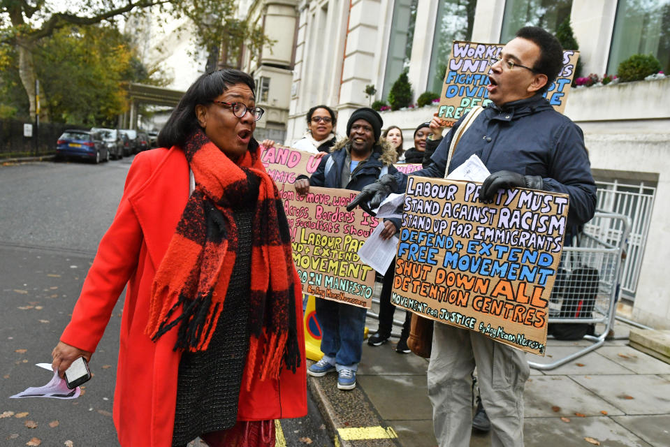 Shadow home secretary Diane Abbott is greeted by pro-immigration protesters as she arrives for a Labour clause V meeting on the manifesto at Savoy Place in London.
