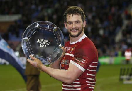 Britain Rugby League - Wigan Warriors v Cronulla-Sutherland Sharks - World Club Challenge - DW Stadium - 19/2/17 Sean O'Loughlin of Wigan Warriors celebrates with the series plate after the game Mandatory Credit: Action Images / Ed Sykes Livepic