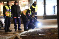 Police are seen in the area after several people were attacked in Vetlanda, Sweden, Wednesday, March 3, 2021. Swedish police say a man has assaulted at least eight people in a southern Sweden town, and that the case was being investigated as ”a suspected terrorist crime.” Police said a man in his 20s attacked people in the small town of Vetlanda, about 190 kilometers (118 miles) southeast of Goteborg, Sweden’s second largest city. (Mikael Fritzon/TT News Agency via AP)
