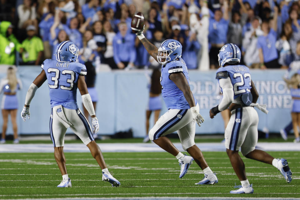 Oct 14, 2023; Chapel Hill, North Carolina, USA; North Carolina Tar Heels defensive lineman <a class="link " href="https://sports.yahoo.com/nfl/players/40057" data-i13n="sec:content-canvas;subsec:anchor_text;elm:context_link" data-ylk="slk:Myles Murphy;sec:content-canvas;subsec:anchor_text;elm:context_link;itc:0">Myles Murphy</a> (8) celebrates after recovering a fumble against the Miami Hurricanes in the second half at Kenan Memorial Stadium. Mandatory Credit: Nell Redmond-USA TODAY Sports