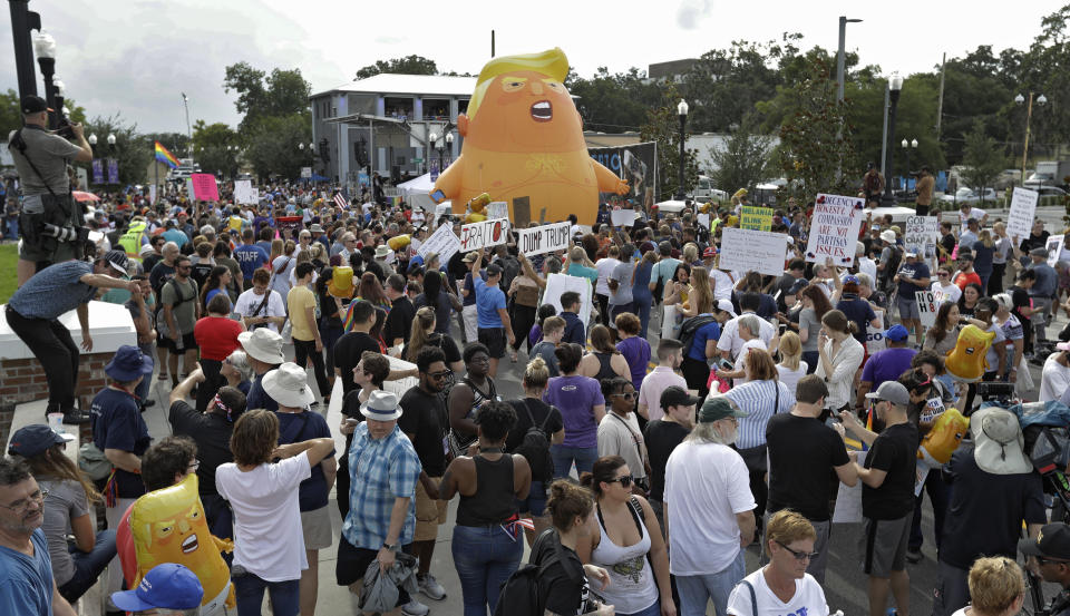 An inflatable Baby Trump balloon towered over protesters during a rally Tuesday, June 18, in Orlando, Florida. A large group protesting against President Donald Trump were rallying near the location where he announced his reelection campaign. (Photo: ASSOCIATED PRESS)