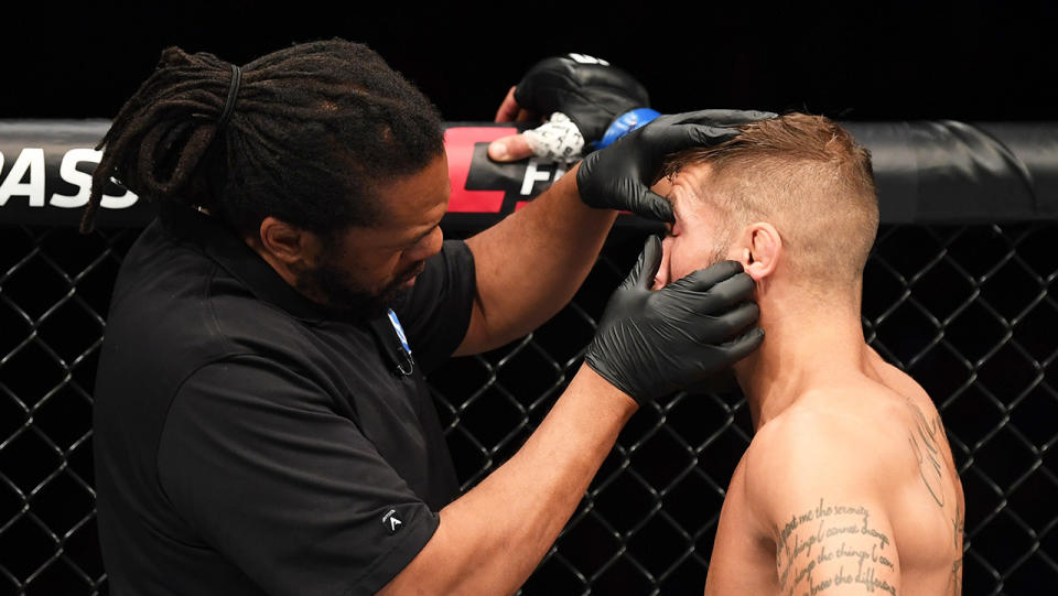 Referee Herb Dean inspects the eye of Jeremy Stephens after an accidental eye poke in his featherweight bout against Yair Rodriguez of Mexico during the UFC Fight Night event on September 21, 2019 in Mexico City, Mexico. (Photo by Josh Hedges/Zuffa LLC/Zuffa LLC via Getty Images)