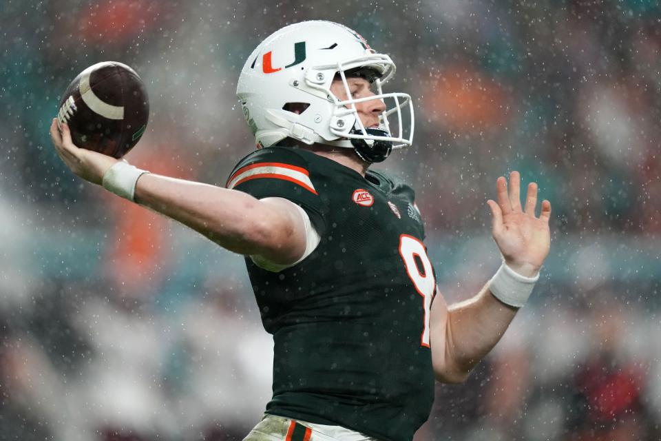 Miami Hurricanes quarterback Tyler Van Dyke (9) attempts a pass against the Virginia Tech Hokies on Nov. 20, 2021, in Miami Gardens.