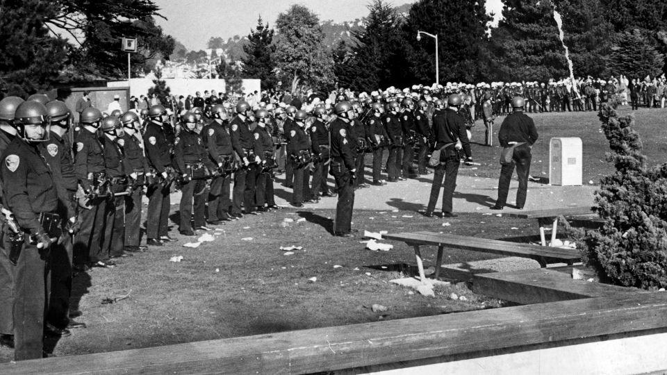 Policemen in riot gear enter the San Francisco State campus in a show of force during student demonstrations that were meant to shut the college down during a strike December 4, 1968. - Jerry Telfer/San Francisco Chronicle via Getty Images