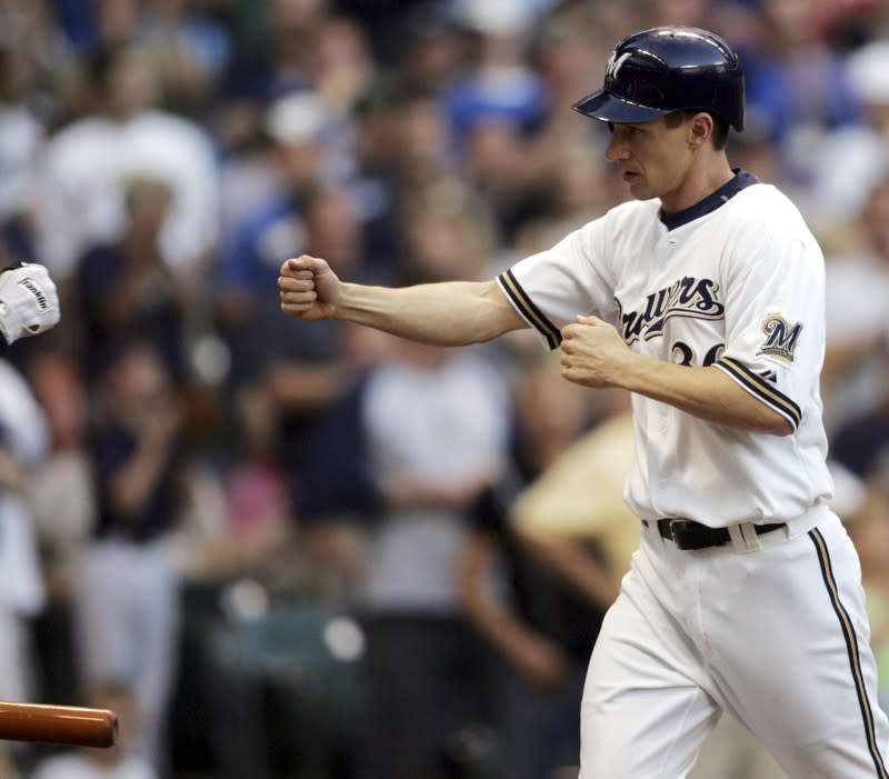 Milwaukee Brewers batter Craig Counsell is congratulated after his first home run of season in Milwaukee