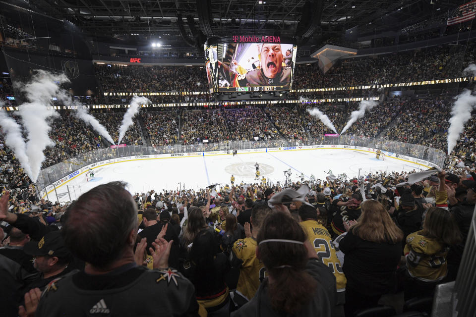 Fans cheer as the Vegas Golden Knights scored against the Dallas Stars during the second period of Game 1 of the NHL hockey Stanley Cup Western Conference finals Friday, May 19, 2023, in Las Vegas. (AP Photo/Sam Morris)