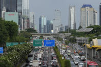 Cars are seen caught in traffic at the main business district in Jakarta, Indonesia, Wednesday, Feb. 7, 2024. A presidential election in Indonesia, the world's third-largest democracy, is highlighting the choices to be made as the country seeks to exploit its rich reserves of nickel and other resources that are vital to the global transition away from fossil fuels. (AP Photo/Achmad Ibrahim)