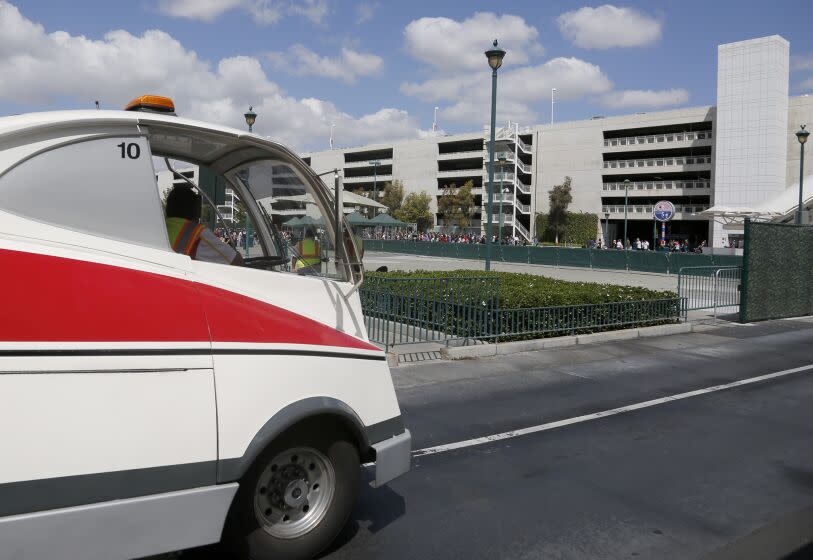 A tram passes the giant Mickey & Friends parking structure at Disneyland in 2017. (Los Angeles Times ).