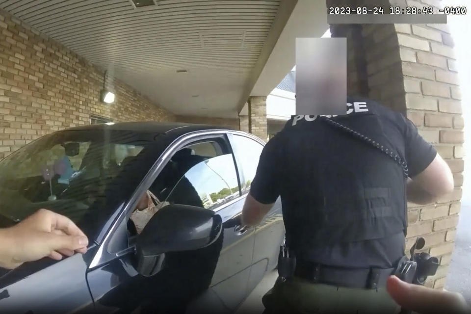 FILE - This image from bodycam video released by the Blendon Township Police on Friday, Sept. 1, 2023, shows a bullet hole in the windshield of a car with Ta'Kiya Young inside after she was shot by a police officer outside a grocery store in Blendon Township, Ohio, a suburb of Columbus, on Aug. 24. The pregnant Black mother was pronounced dead shortly after the shooting. Her unborn daughter did not survive. The image was pixelated by the source. (Blendon Township Police via AP, File)