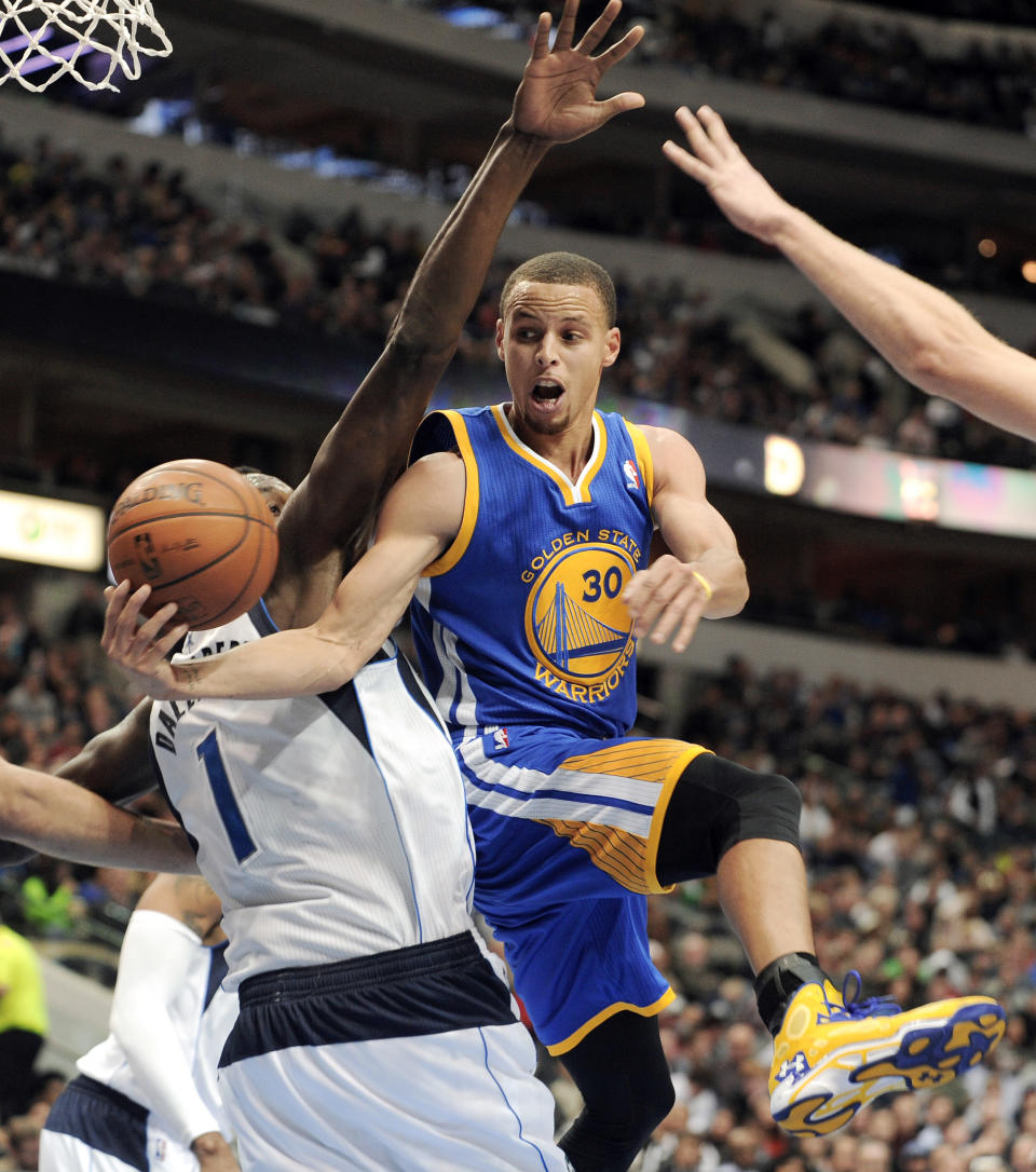 FILE - In this Nov. 27, 2013, file photo, Golden State Warriors point guard Stephen Curry (30) passes around Dallas Mavericks center Samuel Dalembert (1) during the second half during an NBA basketball game in Dallas. Indiana's Paul George and Golden State's Stephen Curry could be first-time starters when the NBA announces the results of fan balloting for the All-Star game on Thursday, Jan. 23, 2013. (AP Photo/Matt Strasen, File)