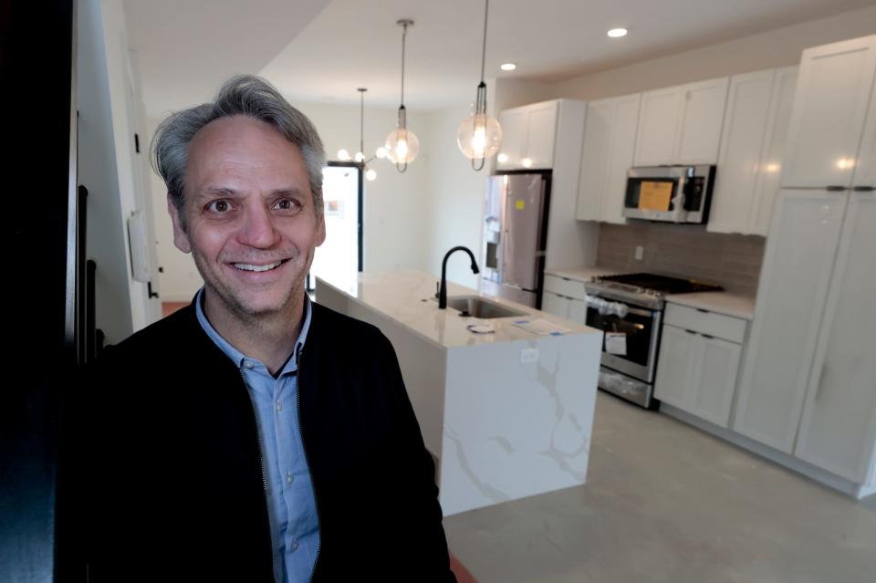 Todd Sykes, vice president of new development with Berkshire Hathaway inside the almost complete model home at the Pallister Gardens townhomes in Detroit on Wednesday, April 26, 2023.