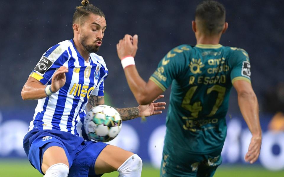 Porto's Brazilian defender Alex Telles vies with Braga's Portuguese defender Ricardo Esgaio - AFP