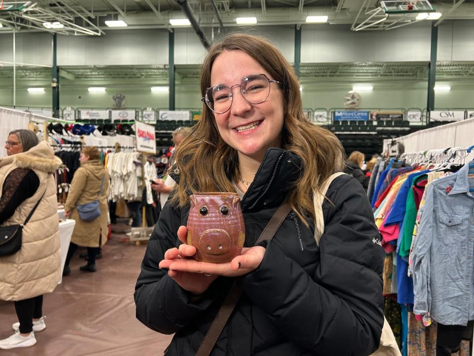 Mckenzie Wilson says she came to shop local at the market for pottery gifts for her family.