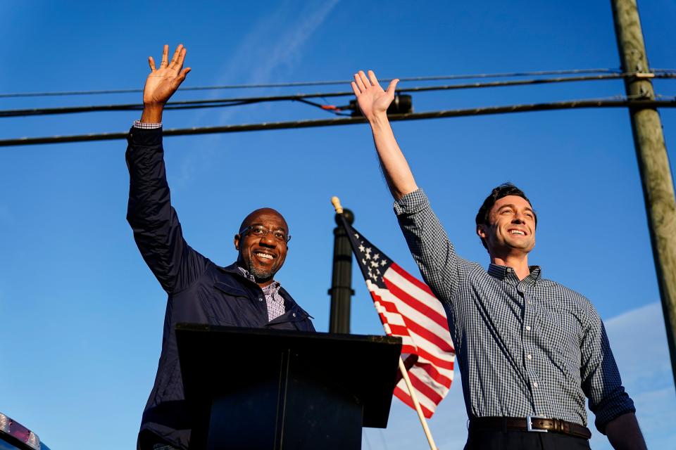 Democratic Senate candidates Raphael Warnock, left, and Jon Ossoff at a campaign rally in Marietta, Ga., on Nov. 15, 2020.