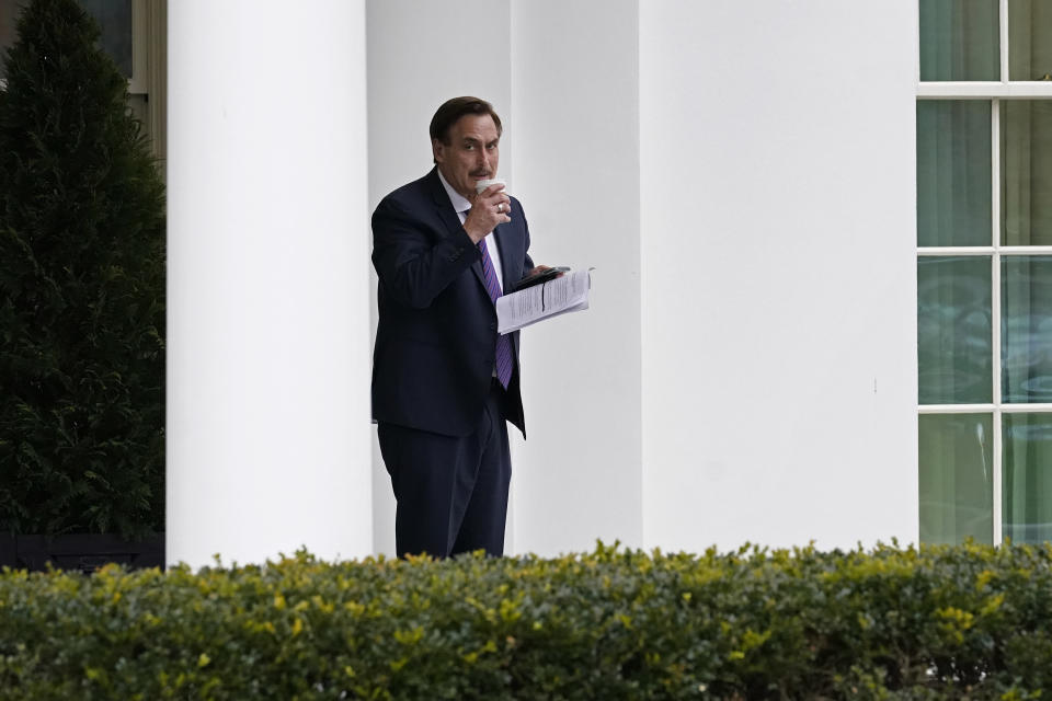 Michael Lindell, CEO of My Pillow, Inc., waits to go into the West Wing of the White House, Friday, Jan. 15, 2021, in Washington. (AP Photo/Gerald Herbert)