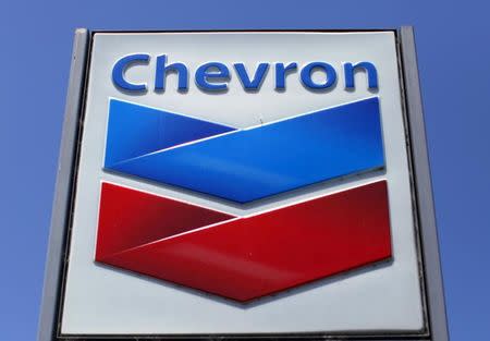 FILE PHOTO: A Chevron gas station sign is seen in Del Mar, California, in this April 25, 2013 file photo. REUTERS/Mike Blake/File Photo - S1AETNALTEAA
