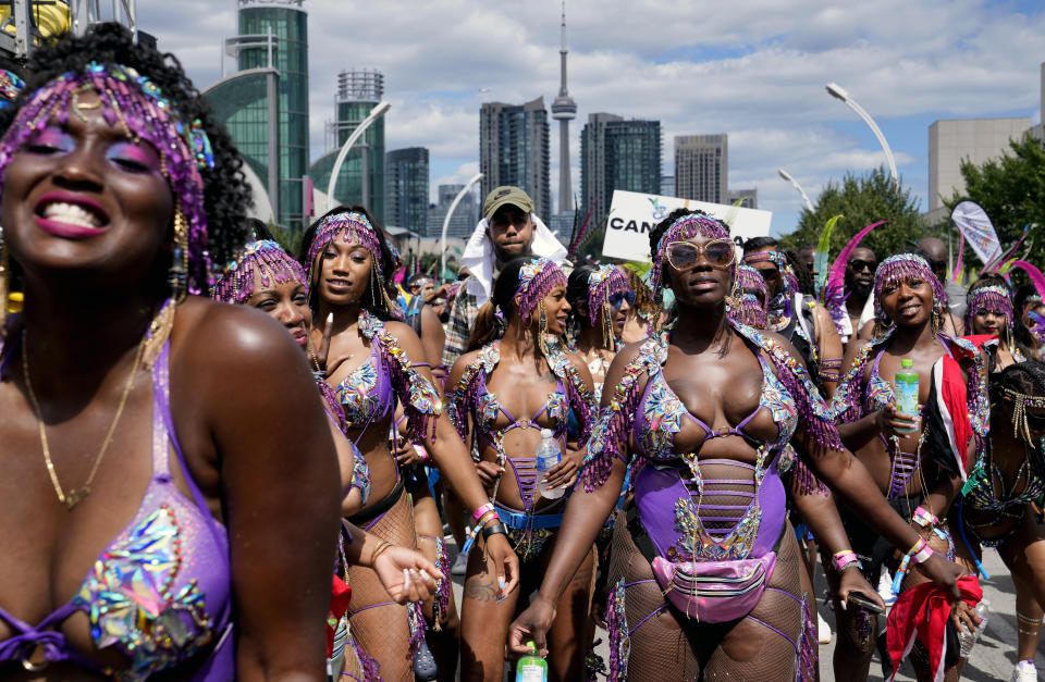 Masqueraders perform during the Caribbean Carnival parade in Toronto, Canada, Saturday, July 30, 2022. The 55th annual parade returned to the streets after the COVID-19 pandemic cancelled it for two years in a row. (AP Photo/Kamran Jebreili)