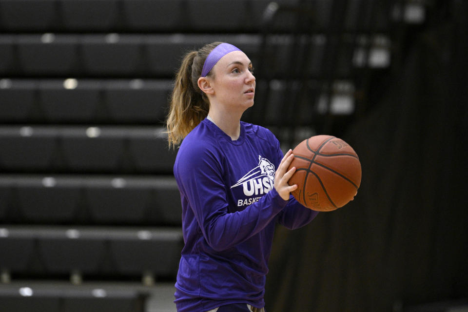 University Health Sciences and Pharmacy guard Grace Beyer warms up before an NAIA college basketball game against Cottey College Thursday, Feb. 22, 2024, in St. Louis. The eyes of the sports world have been trained on Iowa star Caitlin Clark's pursuit of women's basketball scoring history, but some have noticed that Grace Beyer at a tiny NAIA school is the only active player with more points than Clark. (AP Photo/Jeff Le)