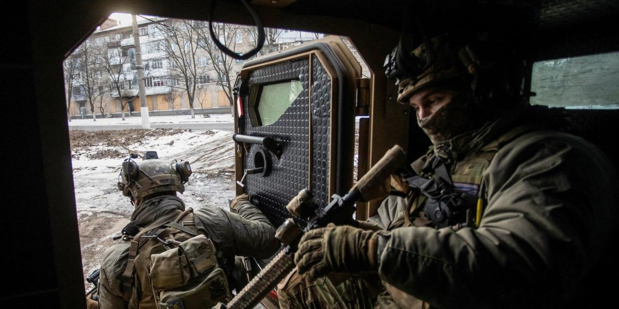 Ukrainian servicemen exit an armoured personnel carrier, amid Russia's attack on Ukraine, in the frontline town of Bakhmut, in Donetsk region, Ukraine February 9, 2023.