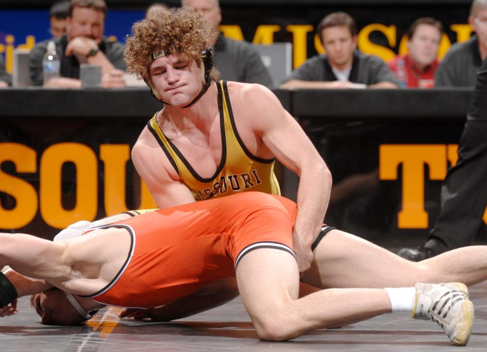 Missouri's Ben Askren, top, gets Oklahoma State's Brandon Mason under control during the 174-pound title match March 3, 2007, in the Big 12 Conference wrestling championships at the Hearnes Center. Askren won 13-4.