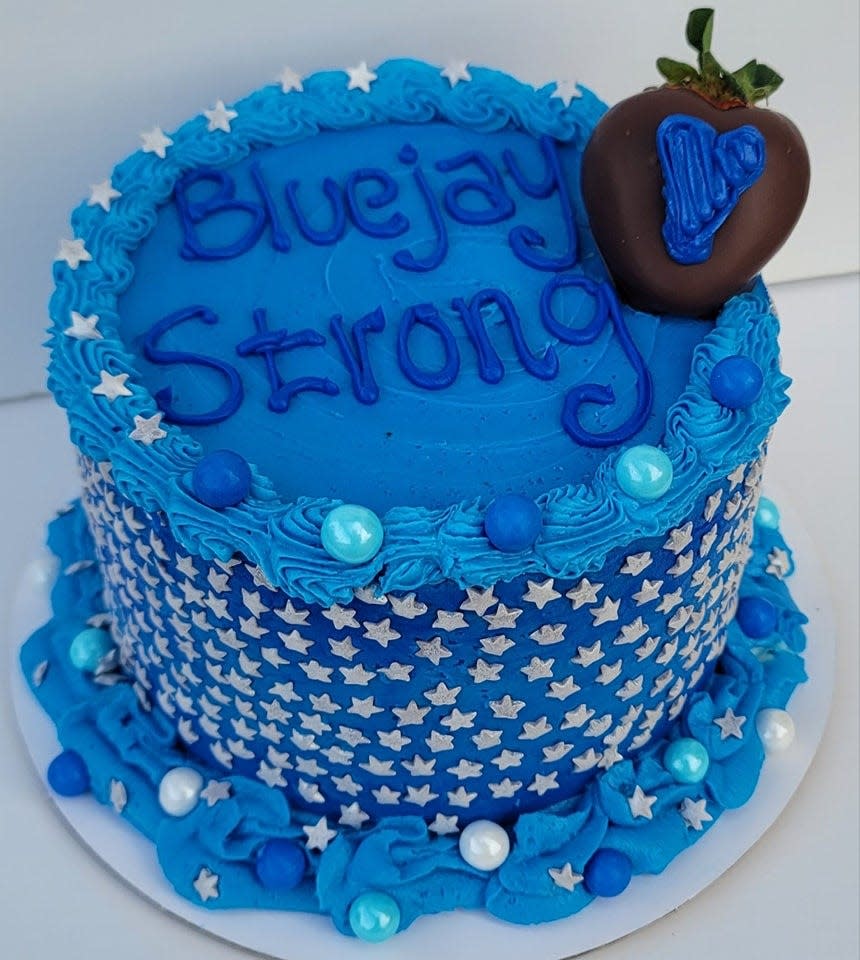 Daphane Bjork, owner of Stop & Smell the Flours in Kelley, recently auctioned a "Bluejay Strong" cake to benefit the family of 11-year-old Ahmir Jolliff, a Perry sixth-grader who was killed in the school shooting Jan. 4. The cake was purchased for $300, and the funds have been given to Jolliff's family.