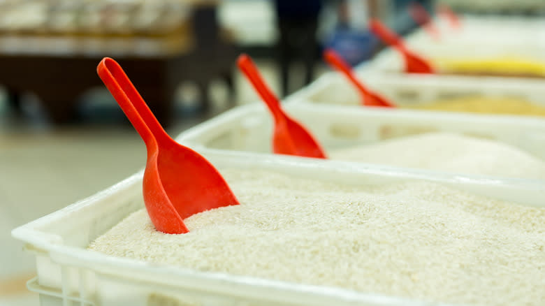 bins of rice with scoops