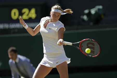 Petra Kvitova of the Czech Republic hits a shot during her match against Jelena Jankovic of Serbia at the Wimbledon Tennis Championships in London, July 4, 2015. REUTERS/Henry Browne