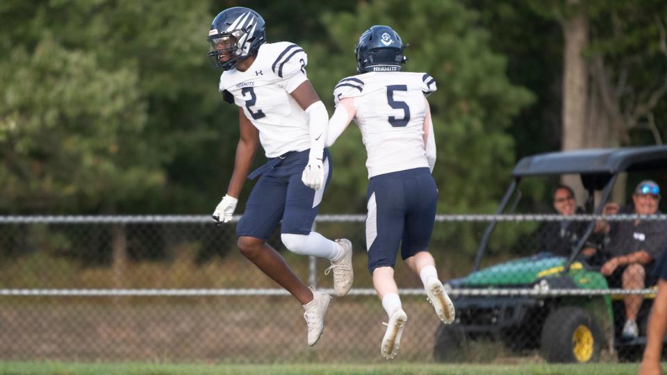 St. Augustine's Terrin Walker, left, celebrates with teammate Tristan McLeer after Walker scored a touchdown during the football game between St. Augustine and St. Joseph played at St. Augustine Preparatory School in Richland on Friday, September 2, 2022.  