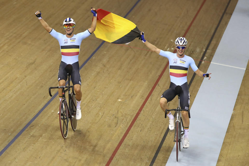Belgium's Kenny De Ketele and Robbe Ghys, right, celebrate winning the Madison Men Final during day five of the 2018 European Championships in, Glasgow, Scotland, Monday Aug. 6, 2018. (John Walton/PA via AP)