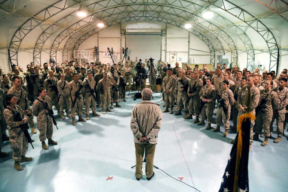 FILE - In this Dec. 8, 2013 pool-file photo, Defense Secretary Chuck Hagel speaks with U.S. troops at Camp Bastion, Afghanistan. President Barack Obama has ordered the Pentagon to plan for a full American withdrawal from Afghanistan by the end of this year should the Afghan government refuse to sign a security agreement with the US the White House said Tuesday. (AP Photo/Mark Wilson, Pool-File)