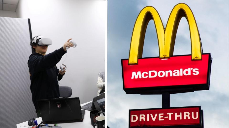 man with VR headset on right, McDonalds drive-through sign to left.