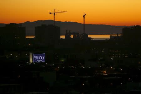 A sign advertising the internet company Yahoo is pictured at sunrise in San Francisco, California in this February 5, 2016 file photo. REUTERS/Mike Blake/Files