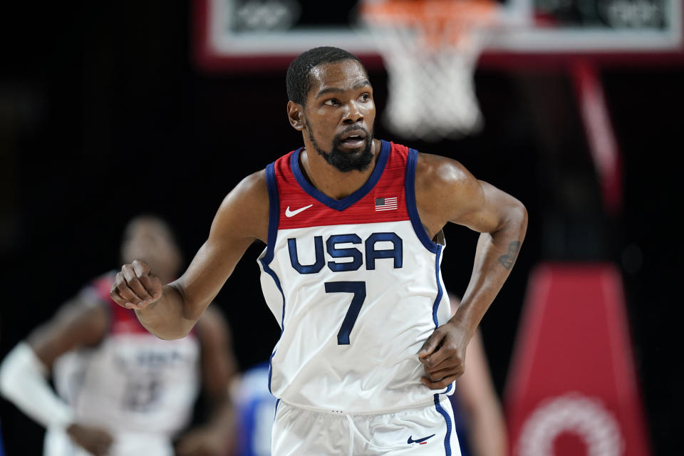 United States's Kevin Durant (7) runs up court after making a 3-point basket during a men's basketball preliminary round game against the Czech Republic at the 2020 Summer Olympics, Saturday, July 31, 2021, in Saitama, Japan. (AP Photo/Charlie Neibergall)