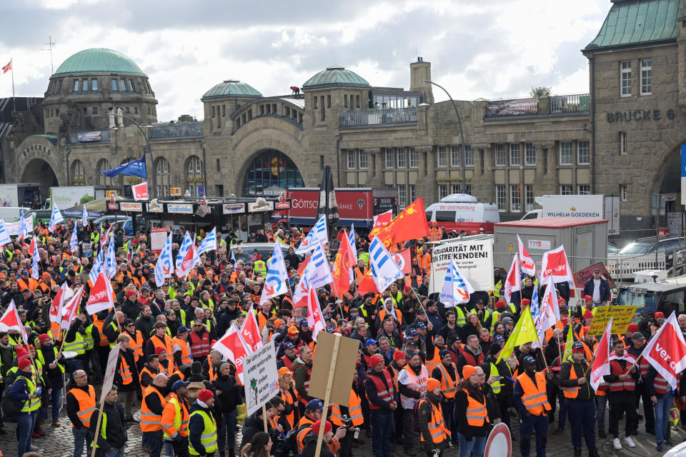 Protestors demonstrate in front of 'Landungsbruecken' at the harbour during a nationwide strike called by the German trade union Verdi over a wage dispute in Hamburg, Germany, March 27, 2023. REUTERS/Fabian Bimmer