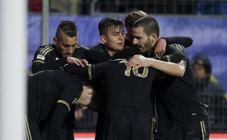 Football Soccer - Frosinone v Juventus Serie A - Matusa Stadium, Frosinone, Italy - 07/02/16. Juventus' Paulo Dybala (C) celebrates with his team mates after scoring against Frosinone. REUTERS/Max Rossi