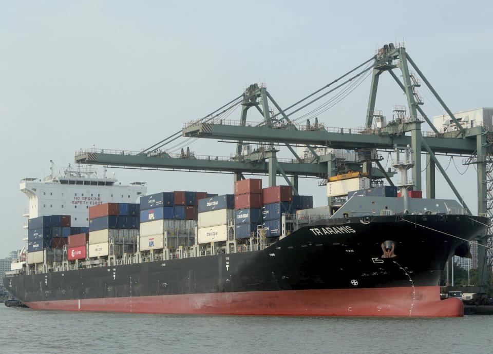 FILE - In this May 3, 2020, file photo, containers are loaded on a ship at the Saigon port in Ho Chi Minh city, Vietnam. China and 14 other countries have agreed to set up the world’s largest trading bloc, encompassing nearly a third of all economic activity, in a deal many in Asia are hoping will help hasten a recovery from the shocks of the pandemic. The Regional Comprehensive Economic Partnership, or RCEP, is to be signed virtually on Sunday, Nov. 15, on the sidelines of the annual summit of the 10-nation Association of Southeast Asian Nations. (AP Photo/Hau Dinh, File)