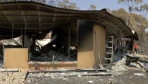 This image made from video shows burnt property in Yeppoon, Queensland state, Australia, Wednesday, Nov. 13, 2019. Wildfires destroyed nine homes on Monday in Queensland state, where air quality plummeted in Brisbane, the state capital, and surrounding cities to the lowest possible rating of "very poor."(Australian Broadcasting Corporation via AP)