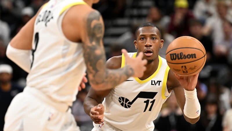 Utah Jazz guard Kris Dunn (11) passes the ball to Utah Jazz guard Keyonte George (3) as the Utah Jazz and Minnesota Timberwolves play at the Delta Center in Salt Lake City on Saturday, March 16, 2024. Minnesota won 119-100.