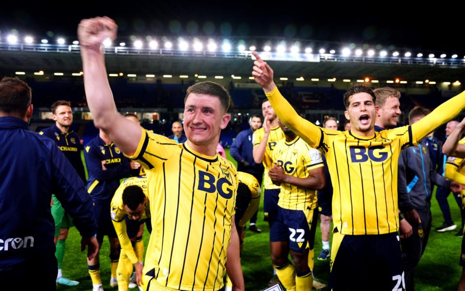 Oxford United's Cameron Brannagan (left) celebrates at the end of the Sky Bet League One play-off semi-final, second leg match at the Weston Homes Stadium, Peterborough