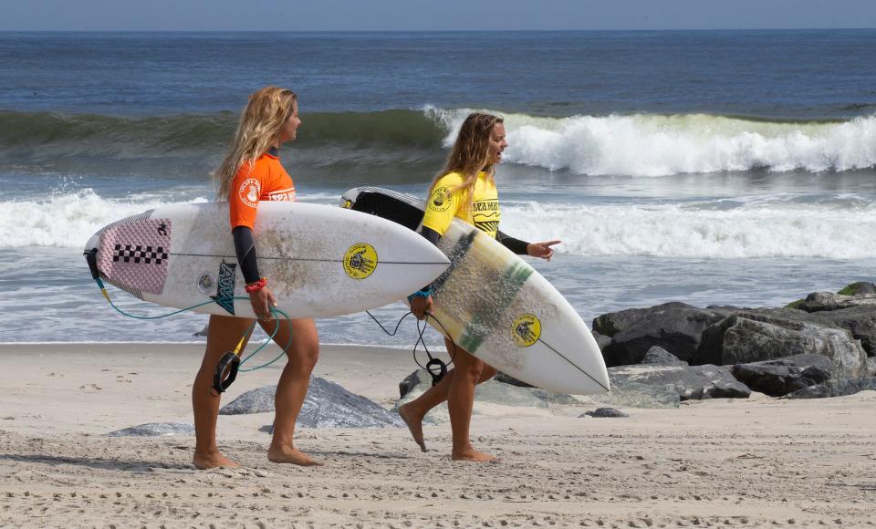 Surfers head to the beach during the 2021 Sea.Hear.Now festival in Asbury Park.