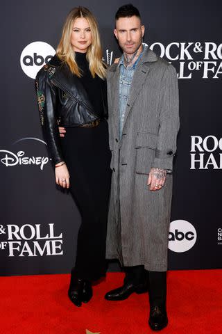 <p>Mike Coppola/WireImage</p> Behati Prinsloo and Adam Levine at Rock & Roll Hall of Fame Induction Ceremony in November 2023