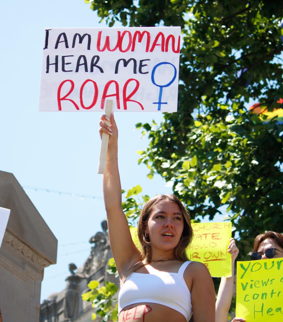 Samantha Lemmons joined other protestors at the Monroe County Courthouse by holding up her sign June 27, 2022, protesting the U.S. Supreme Court's decision to overturn Roe v. Wade.