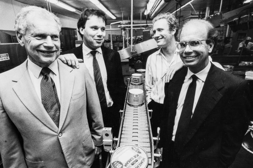 United Dairy Farmers' co-founder Robert D. Lindner Sr. (left) along an ice cream packing line at the company's Norwood headquarters with his sons David, Brad and Robert Jr. in May 1990. The elder Lindner died on Feb. 16, 2022 at age 101.