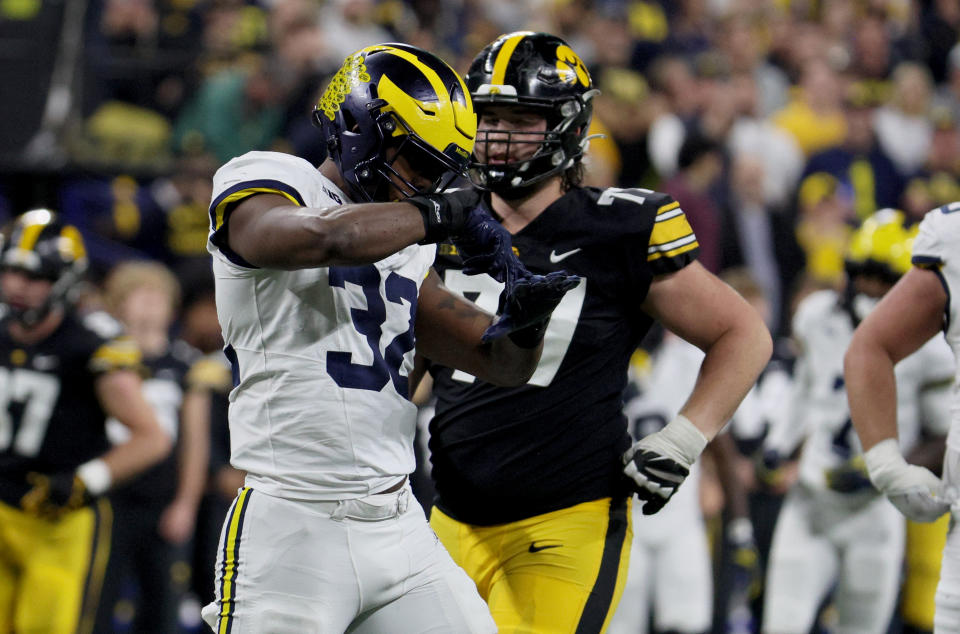 Dec 2, 2023; Indianapolis, IN, USA; Michigan Wolverines defensive end Jaylen Harrell (32) reacts after a play during the first half of the Big Ten Championship game against the Iowa Hawkeyes at Lucas Oil Stadium. Mandatory Credit: Trevor Ruszkowski-USA TODAY Sports