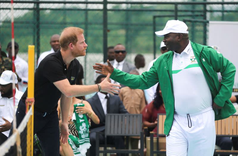 Britain's Prince Harry, Duke of Sussex and his wife Meghan, Duchess of Sussex meet with wounded army veterans in Abuja