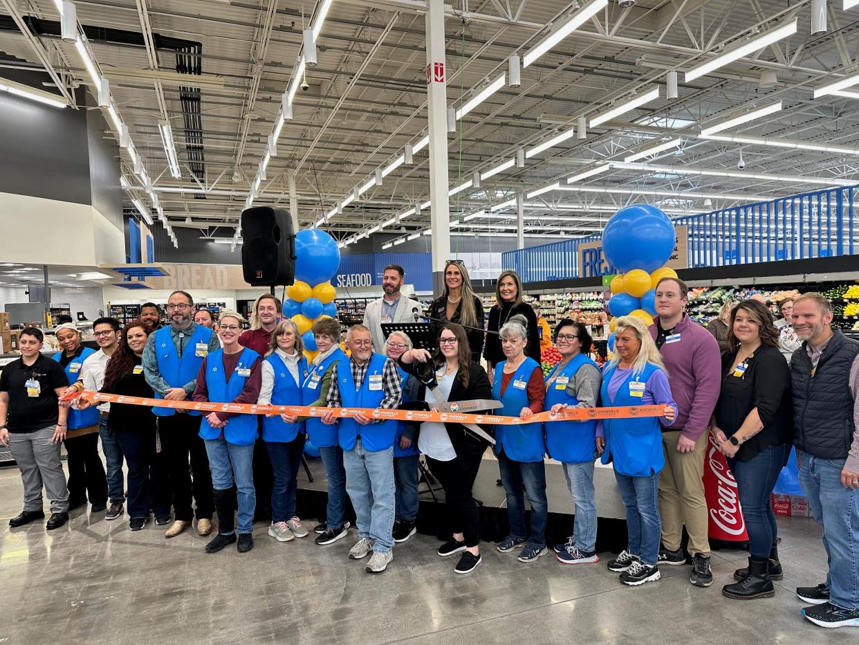 Members of the Walmart staff along with members of the Knox County Mayor and Chamber of Commerce office cutting the ribbon at the Chapman Highway Walmart on November 3, 2023.