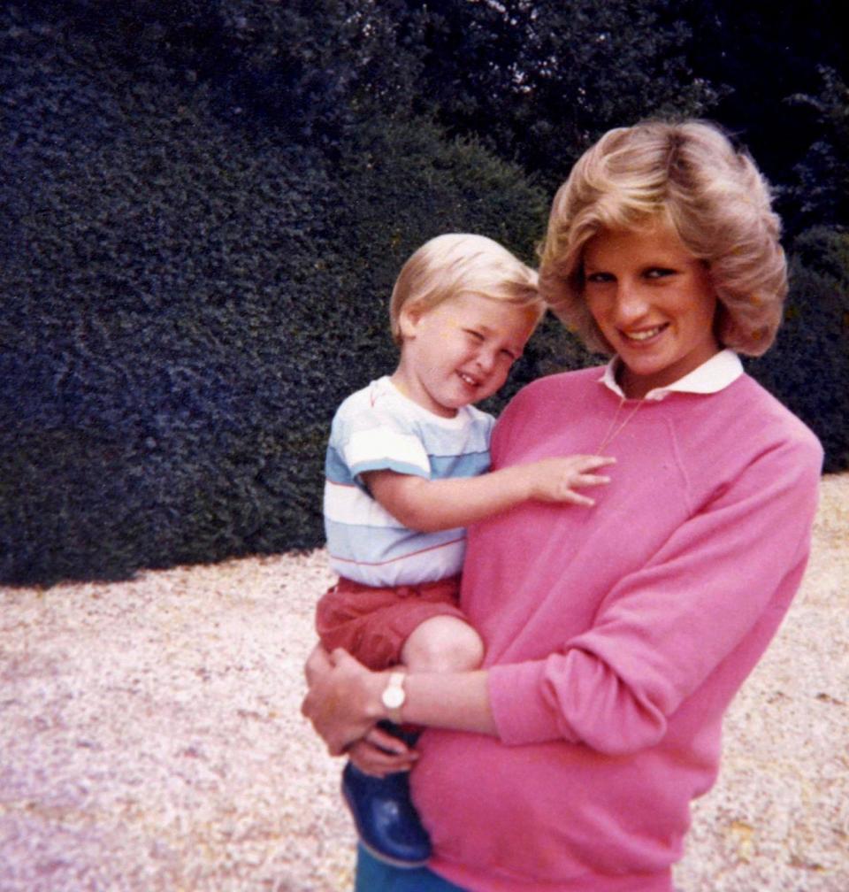 Diana, Princess of Wales, holding Prince William while pregnant with Prince Harry (AFP/Getty Images)