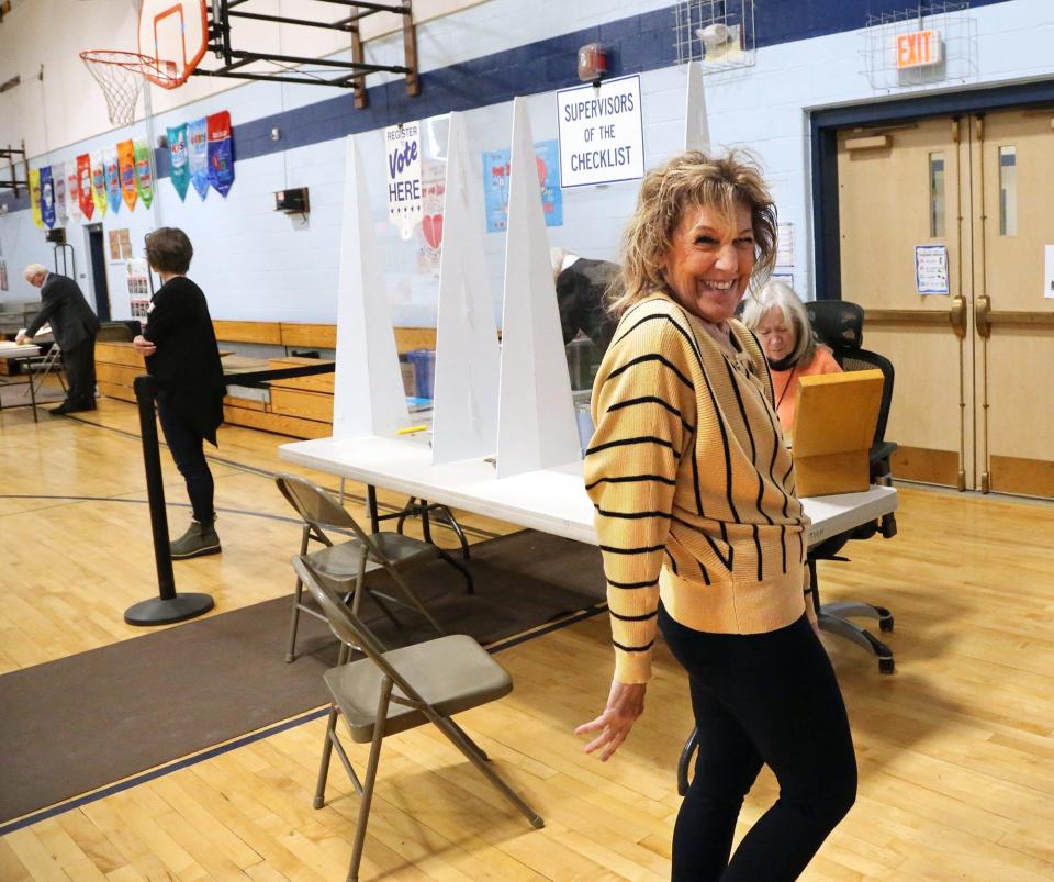 Rye Town Clerk Donna Decotis gives a smile to the camera as she is busy at the polling station during the town election Tuesday, March 12, 2024.