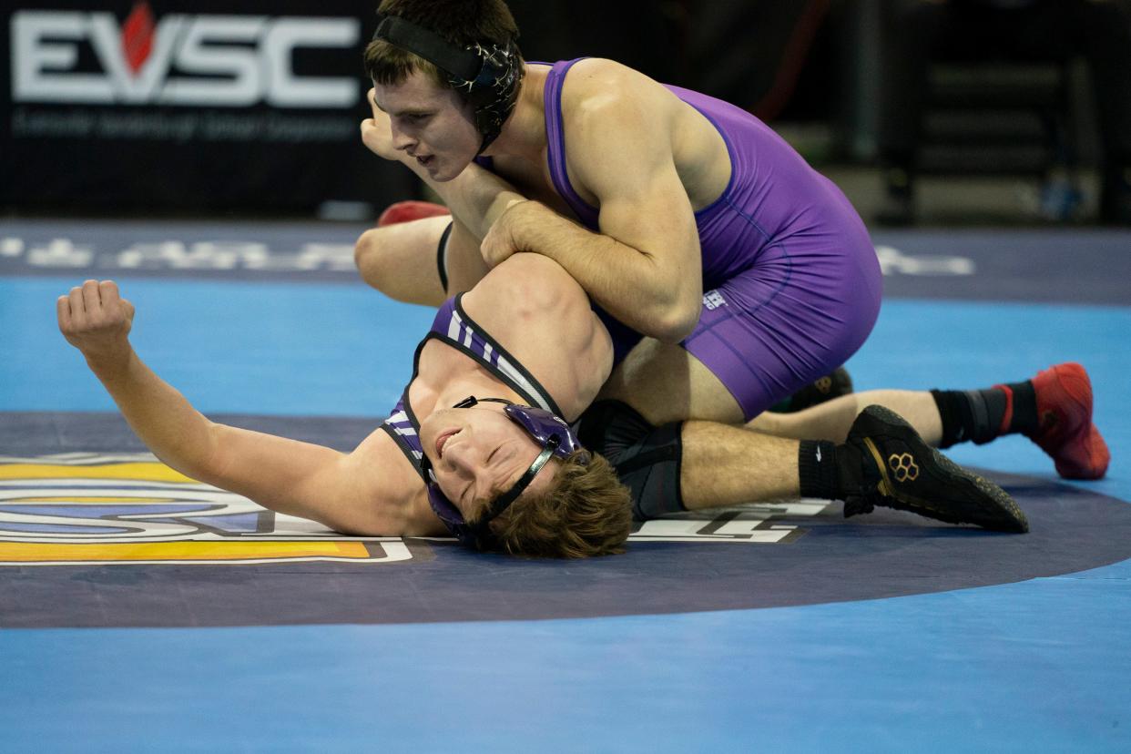 Bloomington South’s Evan Roudebush and Brownsburg’s Jess Derringer compete in the 165-pound championship match of the 2024 IHSAA Semi-State Wrestling tournament at Ford Center in Evansville, Ind., Feb. 10, 2024.